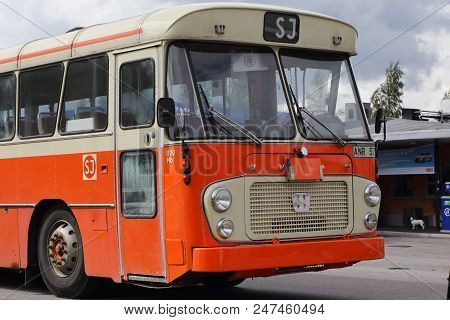 Mariefred, Sweden - August 7, 2016: Old Timer Volvo Public Transportation Bus In Orange Color As It 