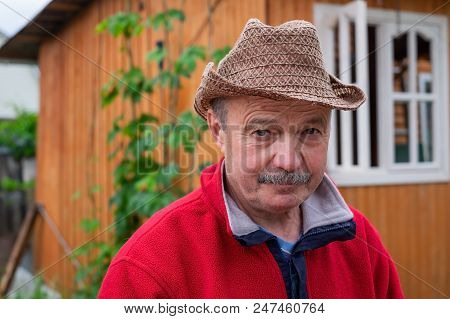 Mid European Adult In Red Pulover Man Resting Outside