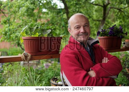 Mid European Adult In Red Pulover Man Resting Outside