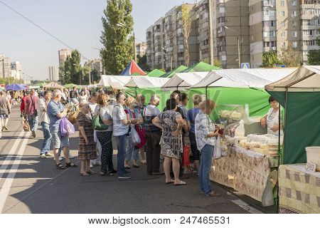 Kiev, Ukraine - June 10, 2018 People Stand In A Long Queue For Food In The Market.