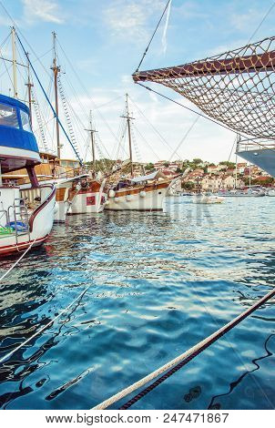 Sailing Ships Anchored In The Harbor, Trogit, Croatia. Travel Destination. Summer Vacation. Travelli