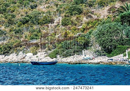 Sea Shore With Little Boat In Maslinica, Solta Island, Croatia. Summer Vacation Destination. Beauty 