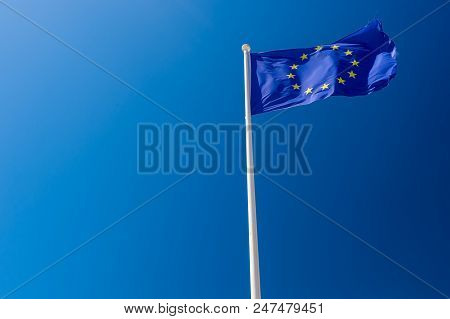 European Flag Waving Against Blue Sky In Wimereux, France.