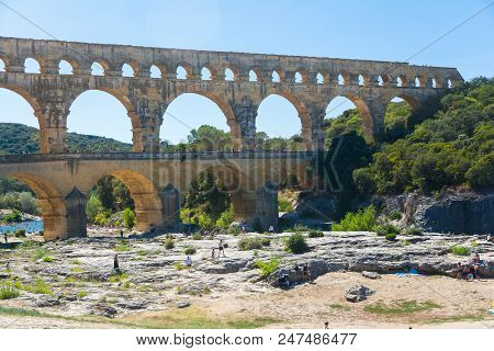 Remoulins,france-august 12, 2016: People Pont Du Gard Roman Aqueduct