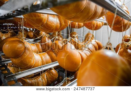 Sausage. Sausage Production Line. Sausage On The Counter For The Smokehouse. Industrial Manufacture