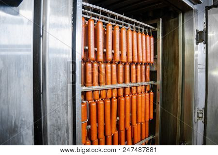 Sausage. The Line For The Production Of Smoked Delicacies. Industrial Manufacture Of Sausage Product