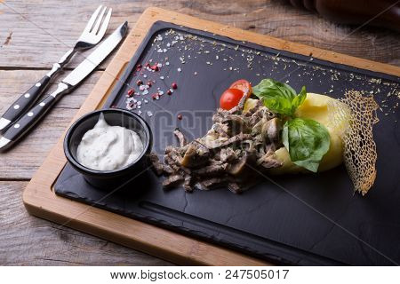Beef Stroganoff Served With Mashed Potato On A Board