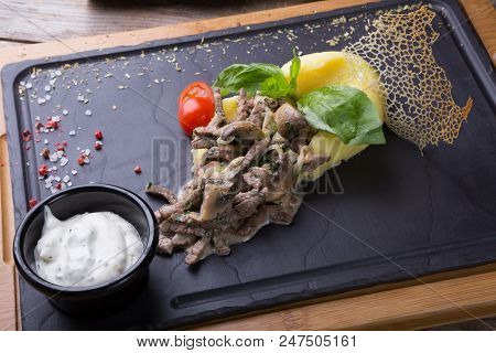 Beef Stroganoff Served With Mashed Potato On A Board