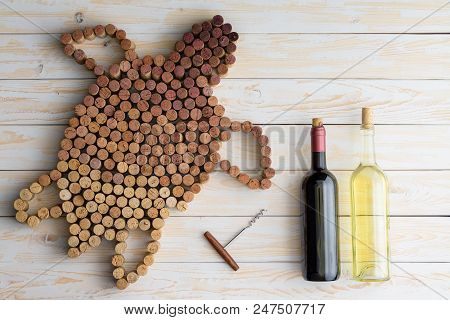 Two Unlabelled Wine Bottles, Red And White With Corkscrew And The Shape Of Marine Turtle Made Of Use