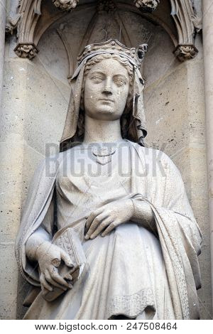 PARIS, FRANCE - JANUARY 05: Saint Radegund, statue on the portal of the Basilica of Saint Clotilde in Paris, France on January 05, 2018.