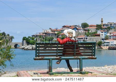 A tourist enjoys amazing view of Historical Amasra - Amasra town, Bartin - Turkey