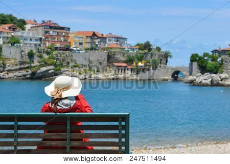 A tourist enjoys amazing view of Historical Amasra - Amasra town, Bartin - Turkey