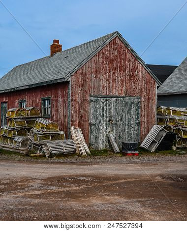 A Scene From The Lobster Fishing Village Of Rustico , Prince Edward Island, Showing A Weathered Shed