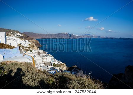 Gourgeous View From White Walled Resort In Santorini, Greece, With Ocean, Cliffs And Caldera Of Sant