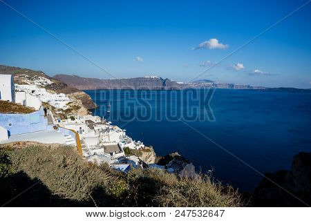 Gourgeous View From White Walled Resort In Santorini, Greece, With Ocean, Cliffs And Caldera Of Sant