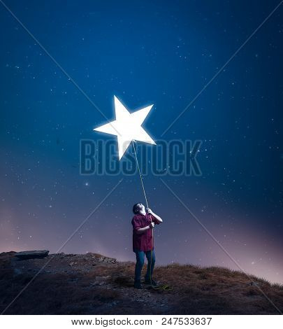 Kid Drag A Star Towards Him With A Rope In The Middle Of The Night. The Concept Of Accomplish His Dr
