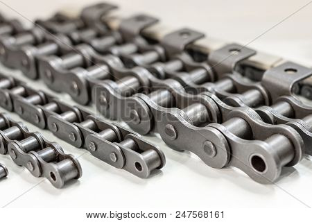 Mental Chain For Mechanical Chain Transfer. Photo With Shallow Depth Of Field. Abstract Industrial B