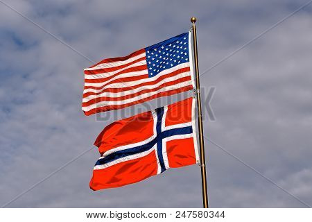 The Norwegian And Usa Flag Blow Together In The Wind
