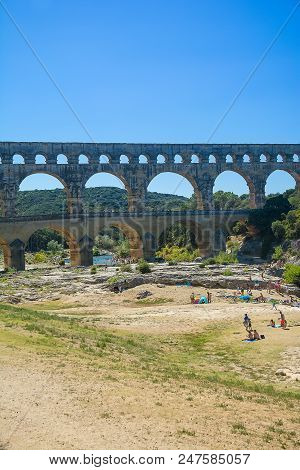 Remoulins,france-august 12, 2016: People Pont Du Gard Roman Aqueduct
