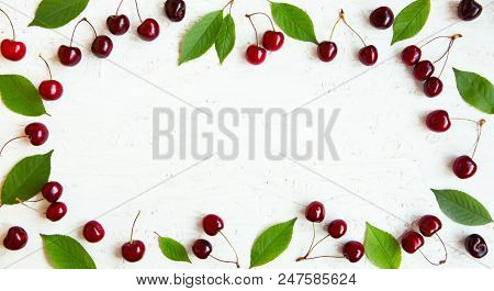 Beautiful Frame Of Cherry Berries. Pattern Of Large Group Of Red Cherry Berries And Green Leaves On 