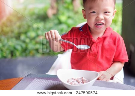 Cute Little Asian 2 Years Old Toddler Baby Boy Child Wearing Red Shirt Use Spoon Eating Chocolate Ce