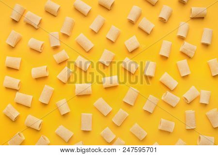 Pattern Made Of Mezzi Pasta On Yellow Background, Top View