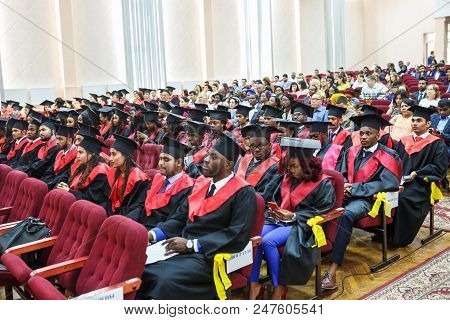 Grodno, Belarus - June, 2018: Foreign African Medical Students In Square Academic Graduation Caps An