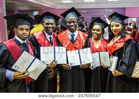 Grodno, Belarus - June, 2018: Foreign African Medical Students In Square Academic Graduation Caps An