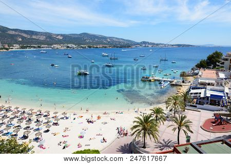 The Tourists Enjoiying Their Vacation On The Beach, Mallorca, Spain