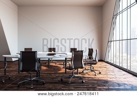 Modern Meeing Room With White Wall And Wooden Flooor In The Morning. 3d Render