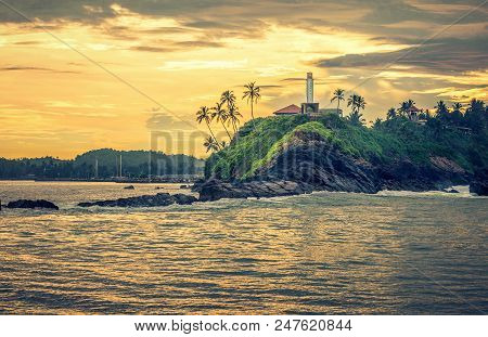 Lighthouse In Mirissa On The Background Of Sunset, Sri Lanka