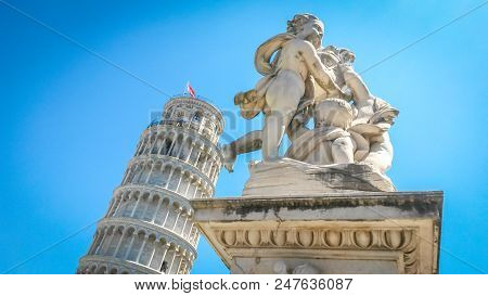 Leaning Tower Of Pisa And Statue Of Cherubs Winged Angels Supporting Heel Of Tower, Pisa, Tuscany, I