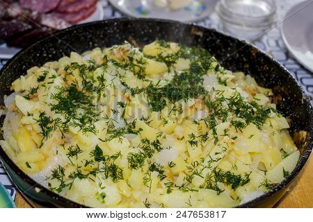 Fried Potatoes On An Iron Frying Pan