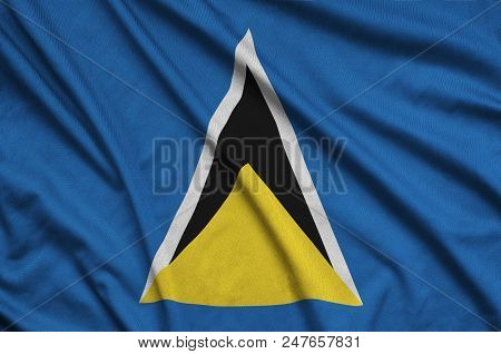 Saint Lucia Flag  Is Depicted On A Sports Cloth Fabric With Many Folds. Sport Team Waving Banner