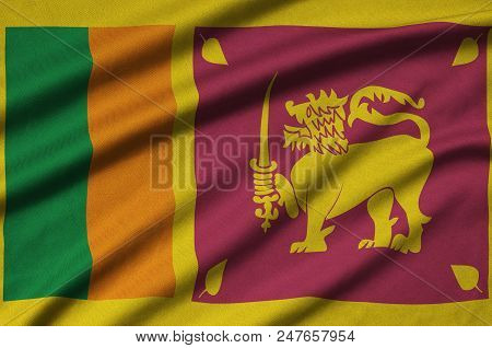 Sri Lanka Flag  Is Depicted On A Sports Cloth Fabric With Many Folds. Sport Team Waving Banner