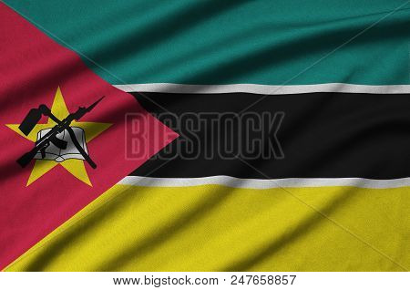 Mozambique Flag  Is Depicted On A Sports Cloth Fabric With Many Folds. Sport Team Waving Banner