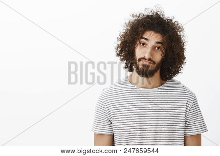 Waist-up Portrait Of Friendly Cute Hispanic Boyfriend With Beard And Afro Hairstyle, Wearing Casual 