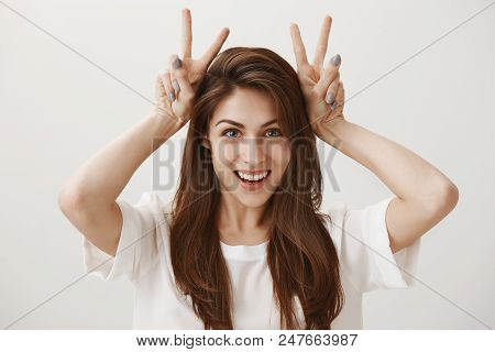 Air Quotes Concept. Portrait Of Attractive Joyful Caucasian Woman With Beautiful Smile Raising Hands