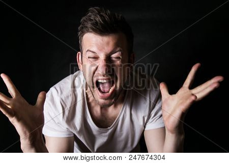 Portrait Of A Young Evil Person On A Black Background, Problems In The Family, Conflation At Work, N