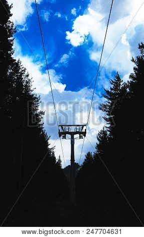 Steel Cable Way Tower Construction, Blue Sky On The Background. A Mountain Rope Way Transportation P