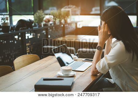 Freelance Of Businesswoman Headache At Cafe, Asian Female Tired,stess Or Deadline With Digital Lapto