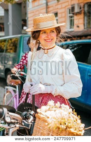Kiev, Ukraine - May 12, 2018: Girl In Vintage Blouse, Skirt, Gloves And Straw Hat Participating In B