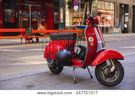 Vienna, Austria - May, 22: Old Red Italian Scooter Called Vespa Manufactured By Piaggio Parked In Th