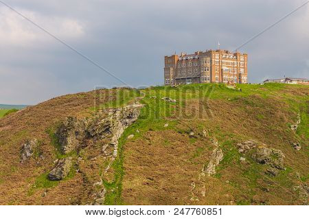 Tintagel, United Kingdom - May 02, 2014: View Of Tintagel Island And Legendary Tintagel Castle Ruins