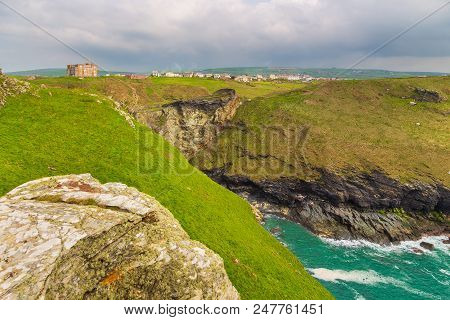 Tintagel, United Kingdom - May 02, 2014: View Of Tintagel Island And Legendary Tintagel Castle Ruins