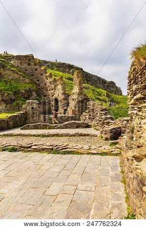 Tintagel, United Kingdom - May 02, 2014: View Of Tintagel Island And Legendary Tintagel Castle Ruins