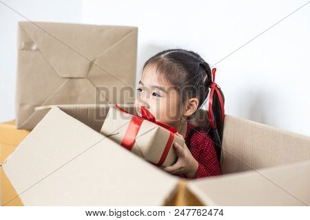 Asian Girl Holding Gift Box. Kid Holding Box With Smiling.