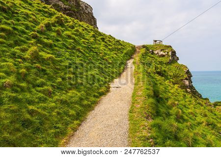 Tintagel, United Kingdom - May 02, 2014: View Of Tintagel Island And Legendary Tintagel Castle Ruins