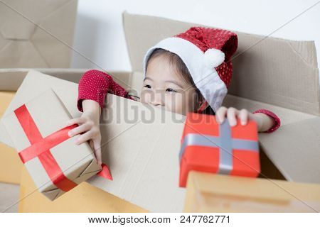 Asian Girl Holding Gift Box. Kid Holding Box With Smiling.