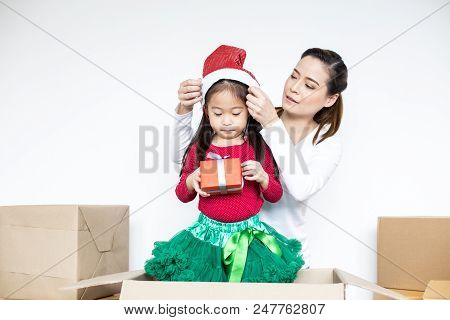 Attractive Asian Girl Received A Present From Her Mom. Kid Received Gift With Attractive Smiling. Ki